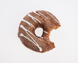 donut or donut with missing bite on a background new.
