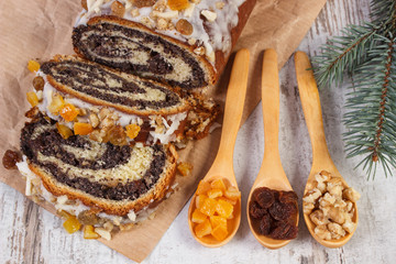 Poppy seeds cake with ingredients for baking and spruce branches, dessert for Christmas