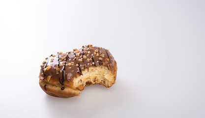 donut or donut with missing bite on a background new.