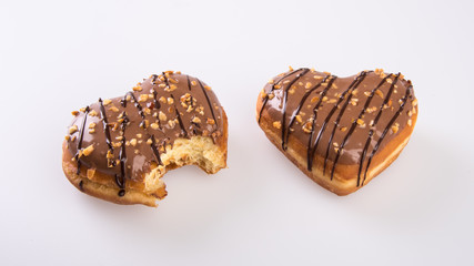 donut or donut with missing bite on a background new.