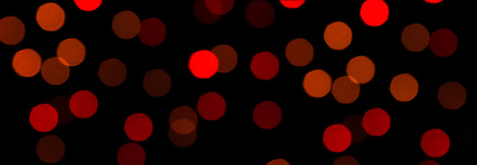 Colorful bokeh lights  on  black background On christmas day.