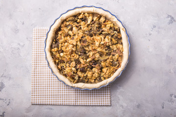 Step by step recipe. Pot pie. Individual open chicken mushroom tart  with puff pastry crust. Top view,  grey stone table