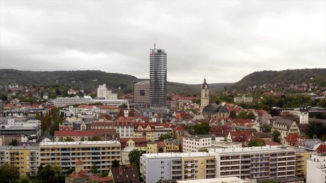 Aerial Overview Of The Town Jena In Eastern Germany. The Drone Is Flying Over The Old Town Straight To The University Tower.