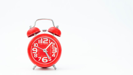 Red alarm clock on white background