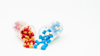 medical drug capsule with bottle on white background