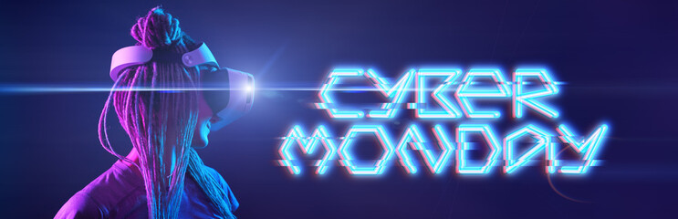Woman is using virtual reality headset with inscription. Cyber Monday concept.