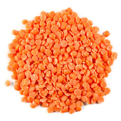 Heap of orange lentils isolated on a white background. Top view.