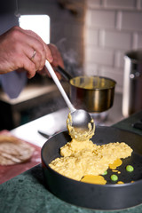 The chef serves the dish Pumpkin Risotto with with duck and parmesan cheese mousse. Seasonal autumnal recipe - risotto with organic pumpkins.
