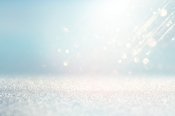 abstract background of glitter vintage lights . silver, gold and white. de-focused