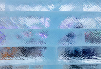 Ice bricks backlit in blue as a background