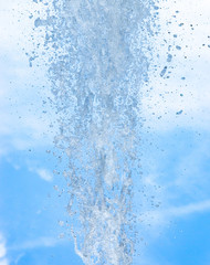 splashing water against blue sky