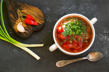 traditional Ukrainian Russian soup (borscht) from beet with greens and sour cream.