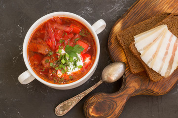 traditional Ukrainian Russian soup (borscht) from beet with greens and sour cream.