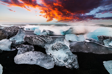 Ice rock with black sand beach at Jokulsarlon beach. Diamond beach in Iceland