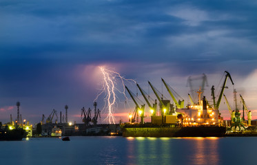 Fototapeta na wymiar Thunderstorm with lightning over dockyard.