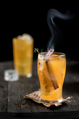 mulled wine and orange on a dark background