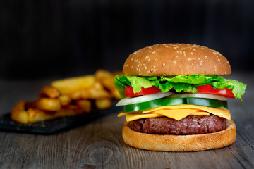 hamburger with french fries and cheddar cheese
