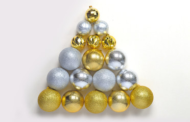 Christmas balls and branches on a light background