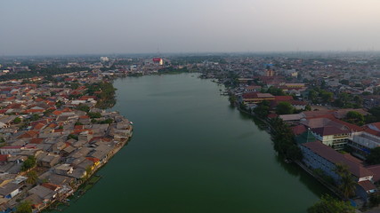green lake in the middle of urban areas