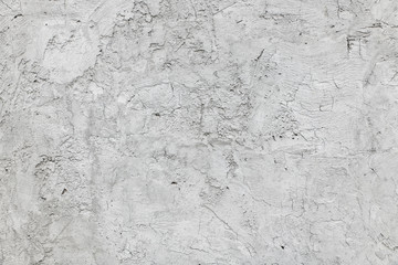 Cracked stucco on the wall. Concrete background.