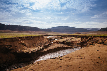 The bottom of the empty Studena dam near Pernik, Bulgaria. Hot weather and climate changes makes the dam almost empty. November 2019. Climate disaster.