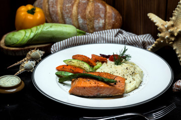 norwegian salmon and mashed potato served with boiled vegetables