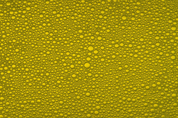 yellow bubbles on the liquid surface