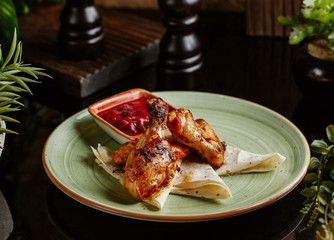 fried marinated chicken legs served with sour sauce