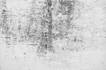 Close-up of White cement wall peeled paint caused by water and sunlight. Peel wall of White house paint with black stain. Black and White of Texture background.