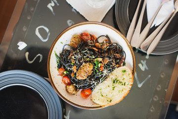 black pasta with Thai sausage