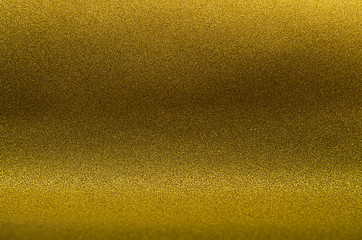 Golden metallic abstract texture for Christmas and festive design.