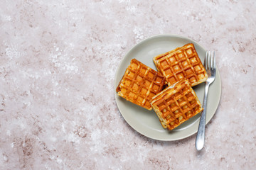 Delicious breakfast with coffee, orange juice, waffles,croissants,jam,nut paste on light background,top view