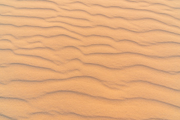 Fototapeta na wymiar Wave of sand texture. Mui Ne,Vietnam, copy space