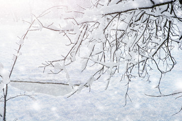 Falling snow on the lake with an ice hole. Heavy snowfall