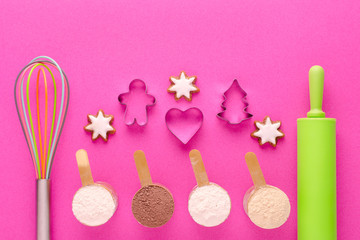baking protein with kitchen tools and cookie cutter on pink background