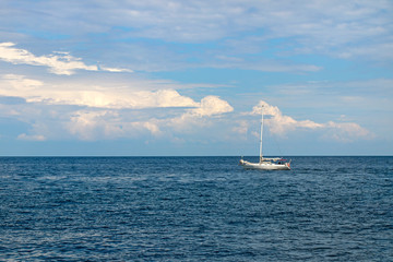 Seascape. Blue sky with clouds and calm sea.People travel by sea in the summer.
