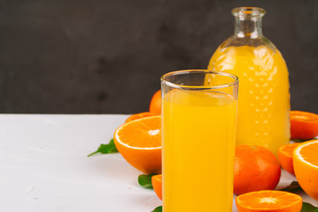 Glass of orange juice and orange slices