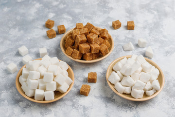 Various types of sugar, brown sugar and white on concrete background,top view