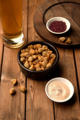 mini fried dumplings as beer snack served with sauce and sumac