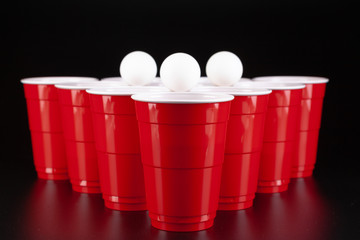 The arrangement of red plastic cups for game of beer pong