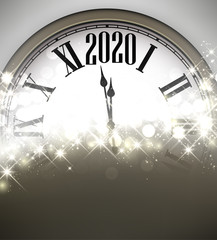 Obraz na płótnie Canvas Golden shining 2020 New Year background with clock.