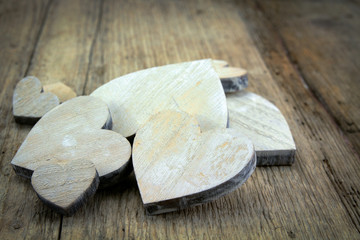several wooden hearts on a wooden table