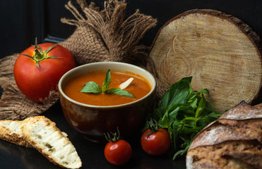 tomato soup garnished with cheese and mint