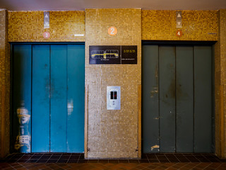 Empty lift lobby in an old industrial building © YongHeng