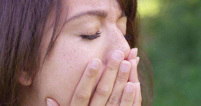 Close Up - A young woman shakes her head in dismay - shot on RED
