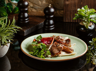 lamb kebab served with flatbread and pomegranate sauce