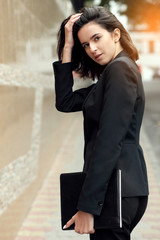 Portrait of business woman smiling outdoor