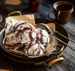 chocolate christmas crinkle cookies in copper plates