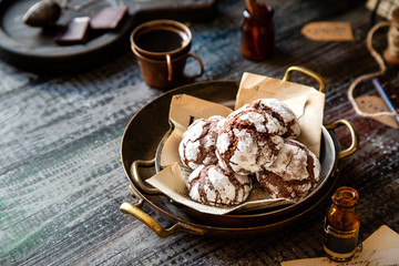 chocolate christmas crinkle cookies in copper plates