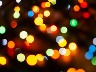Christmas light background. Holiday glowing backdrop. Defocused Background. Blurred Bokeh.